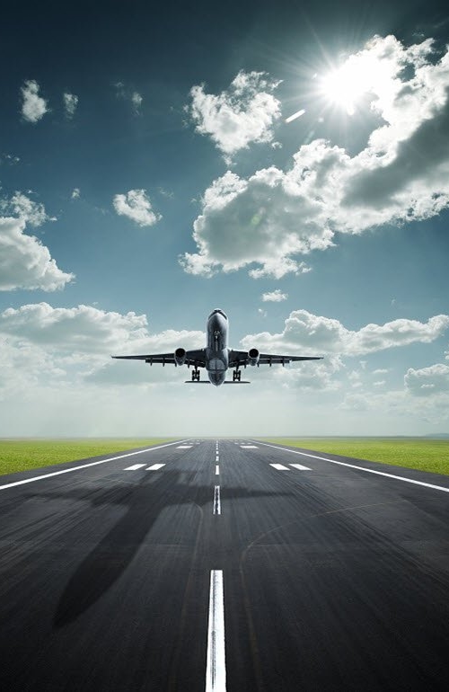 Aeroplane landing with sky clouds