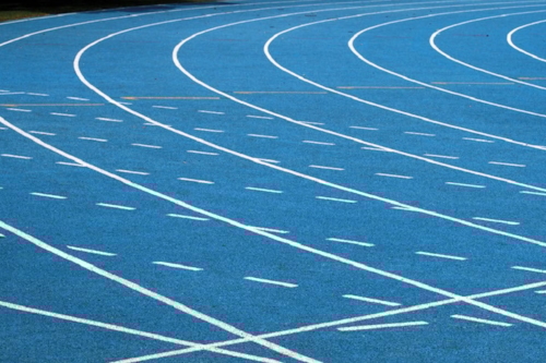 A blue sport facility with a athletics track field