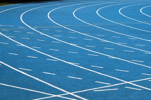 A blue sport facility with a athletics track field