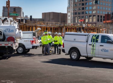 A group of T2UE Engineers having a meeting at a client site